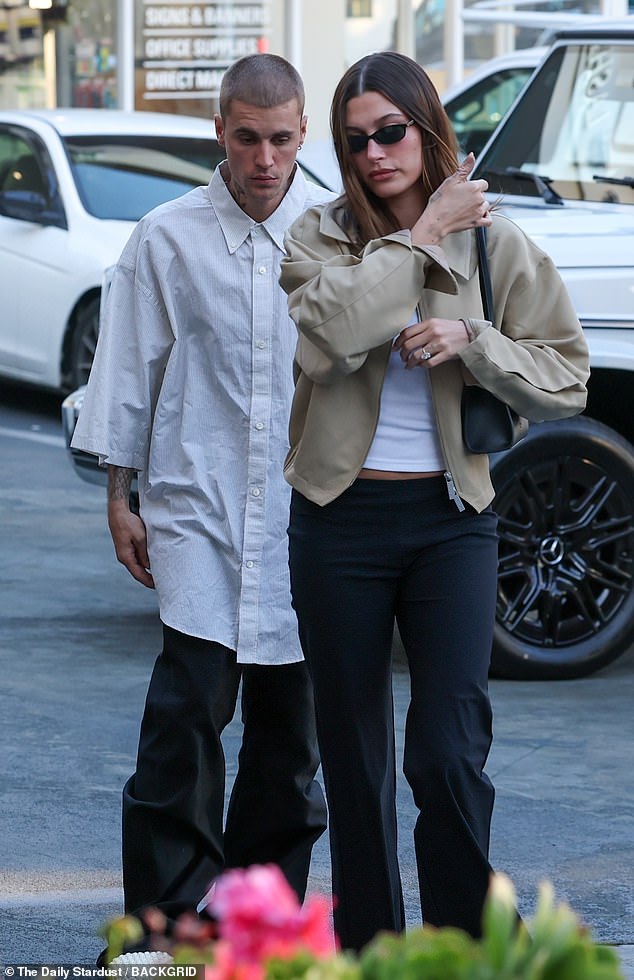 Title: Justin Bieber Sheds Unkempt Look During Tense Outing with Hailey After Selena Gomez’s ‘Shade’  
Explanation: The revised title removes subjective terms like "concerning" and rephrases "ditches" as "sheds" for a neutral tone. It retains key details (appearance change, outing with Hailey, Selena Gomez’s "shade") while avoiding sensationalism.