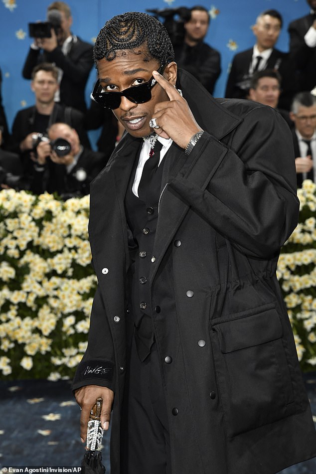 A$AP Rocky Faces Criticism as Fans Detect Ominous Detail in Met Gala Attire Following Gun Case Acquittal
This title maintains the core elements of the original while using more formal synonyms ("Faces Criticism," "Detect," "Ominous," "Attire") and clarifies the legal outcome ("Acquittal") for precision.