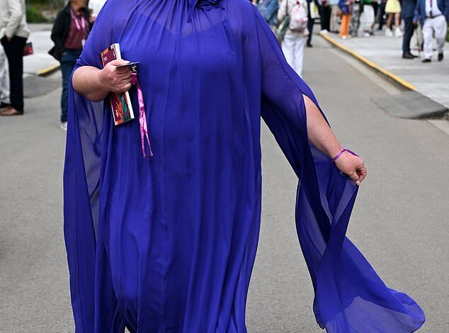 Revised Title:
"Gemma Collins Stuns in Sheer Dress with Ferne McCann, Tasha Ghouri, and Myleene Klass at Chelsea Flower Show"  
Key Adjustments:  

Simplified "slips her slimmer frame into" to "stuns in" (avoids body-focused language).  
Removed "glamorous" (redundant with context).  
Corrected "Myleen" to "Myleene Klass."  
Trimmed "star-studded" (implied by celebrity attendees).  
Streamlined phrasing for conciseness and flow.
