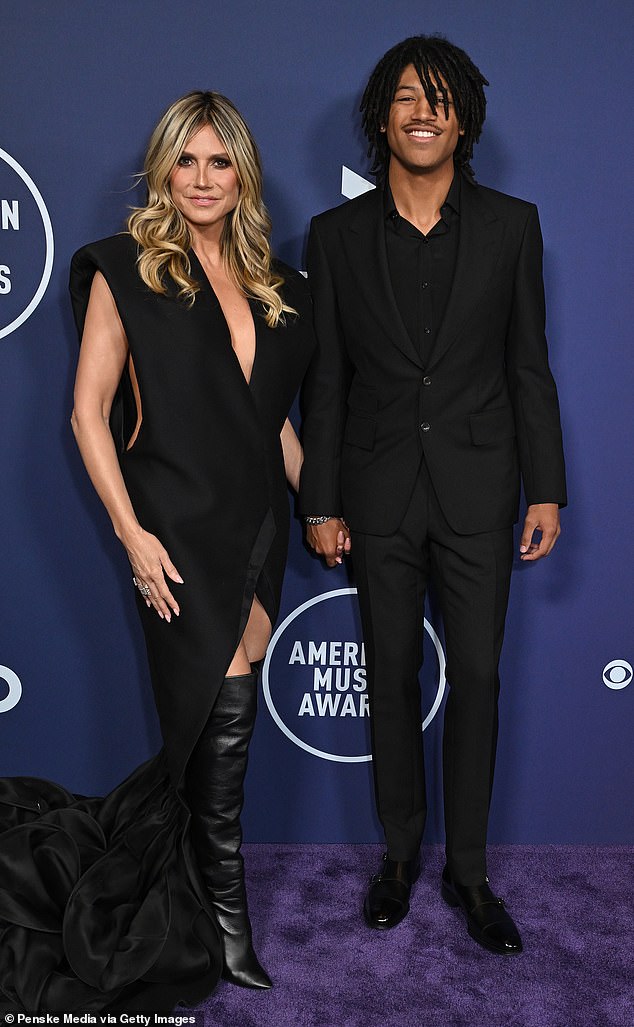 Revised Title:
"Heidi Klum’s 19-Year-Old Daughter Stands Taller Than Her in Rare AMAs Red Carpet Appearance"
Key Adjustments:
Removed informal term "nepo baby" for clarity.
Simplified "towers over" to "stands taller than."
Streamlined phrasing for conciseness and formality.