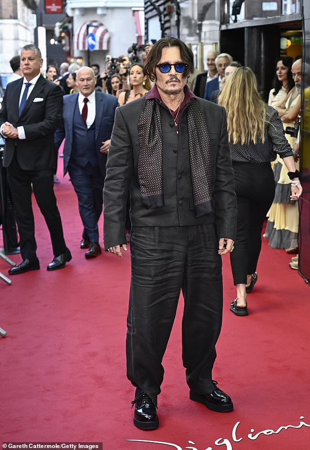 Title: Johnny Depp Supported by Ronnie and Sally Wood at UK Premiere of New Film Following Revelation of Inner Circle’s Betrayal Amid Amber Heard Abuse Allegations