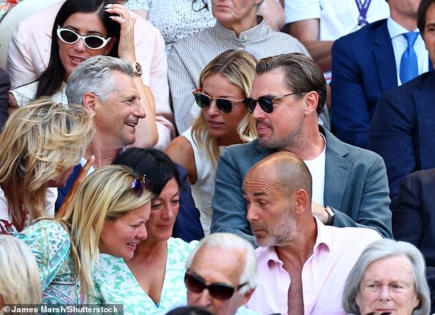 Title: "Leonardo DiCaprio, 50, Charms Wimbledon Crowd by Dropping Disguise, Revealing Striking Looks and Helping Elderly Guests"