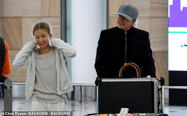 "Sonia Kruger and Daughter Maggie, 10, Flaunt Striking Resemblance During Rare Sydney Airport Outing"  
This version retains key details (names, age, resemblance, location) while streamlining phrasing for clarity and impact.