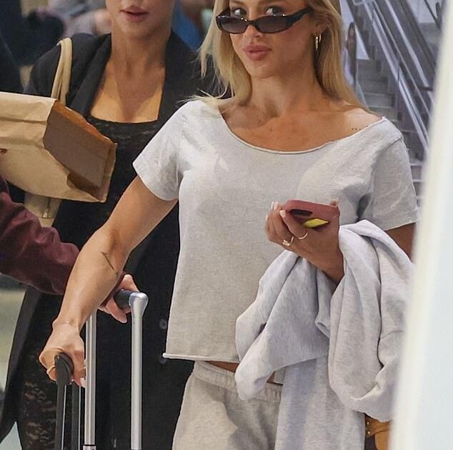 Tammy Hembrow Offers Relationship Update While Sporting Casual Tracksuit at Sydney Airport