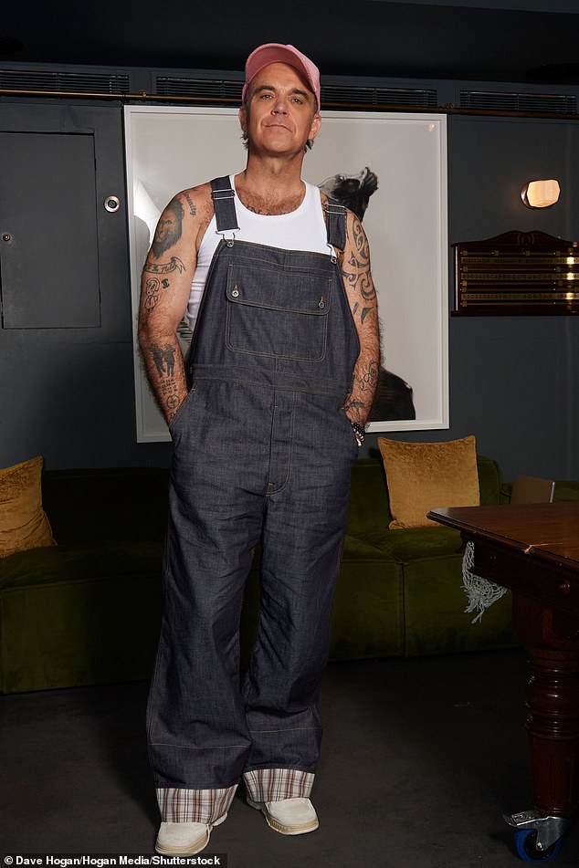 Title: Robbie Williams, 51, Revives Iconic Take That Dungarees at Album Q&A and Addresses Hair Thinning Daily