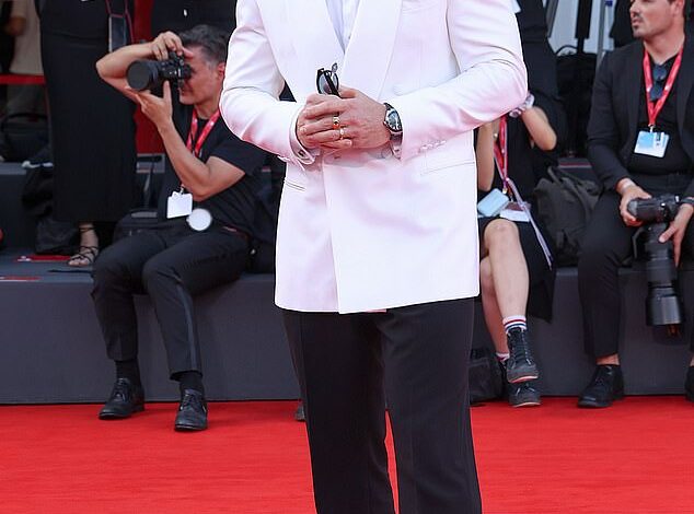 Aaron Taylor-Johnson Sports Bushy Beard and Curly Hair at Venice Film Festival’s Frankenstein Premiere Amid Shift in James Bond Casting Rumors  
This version condenses key details (transformative appearance, event context, Bond speculation) while maintaining clarity and flow.