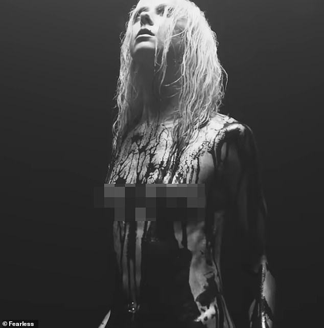 Title: "Gossip Girl Star Taylor Momsen Appears Naked in New Music Video"
This version maintains clarity, removes sensationalized formatting (all caps), and preserves key details: her association with Gossip Girl, the context of the music video, and the mention of nudity.