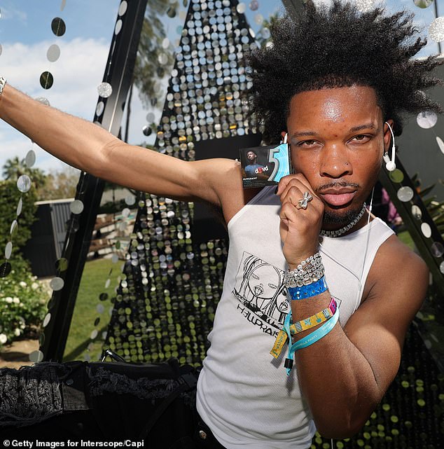 Rewritten Title:
"Interscope Halts Promotion of Artist D4vd Amid Investigation Into Teen Girl Found Dead in Tesla Trunk"  
Key Adjustments:  

Simplified phrasing ("Halts Promotion" vs. "stops promoting").  
Condensed the incident description ("Teen Girl Found Dead in Tesla Trunk" for clarity and brevity).  
Maintained factual accuracy while streamlining structure.

