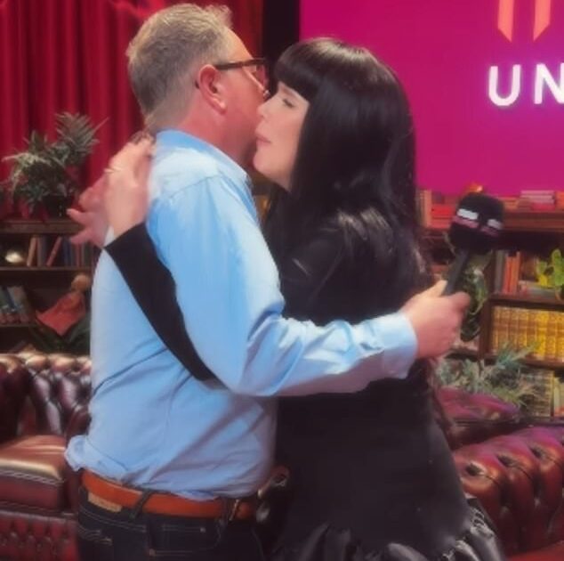 Title: Paloma Faith and Alan Carr Exchange Begrudging Hug at Celebrity Traitors Reunion Following Apology for ‘Murdering’ Her  

Key Adjustments:  

Removed redundant phrasing ("one another," "he apologised") while retaining clarity.  
Streamlined structure for conciseness.  
Maintained quotes around ‘murdering’ to highlight contextual/figurative use.  
Italicized Celebrity Traitors as a show title.  
Used "Following" instead of "After" for smoother flow.
